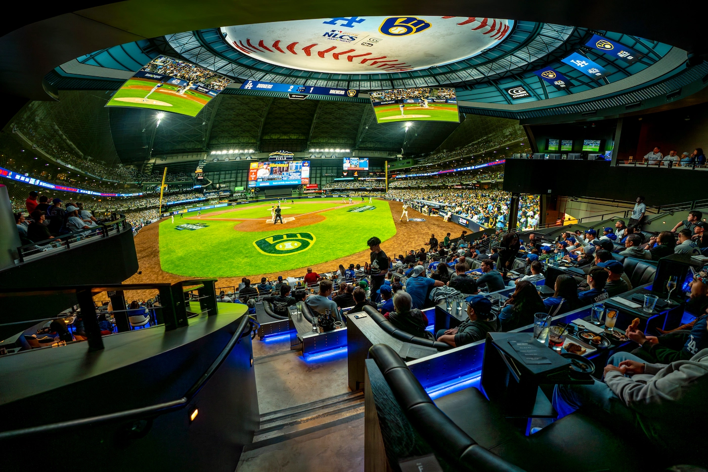 Baseball crowd watching inside the Cosm Dome