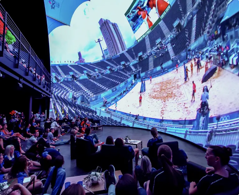 Cosm content partnerships shown on a large immersive display