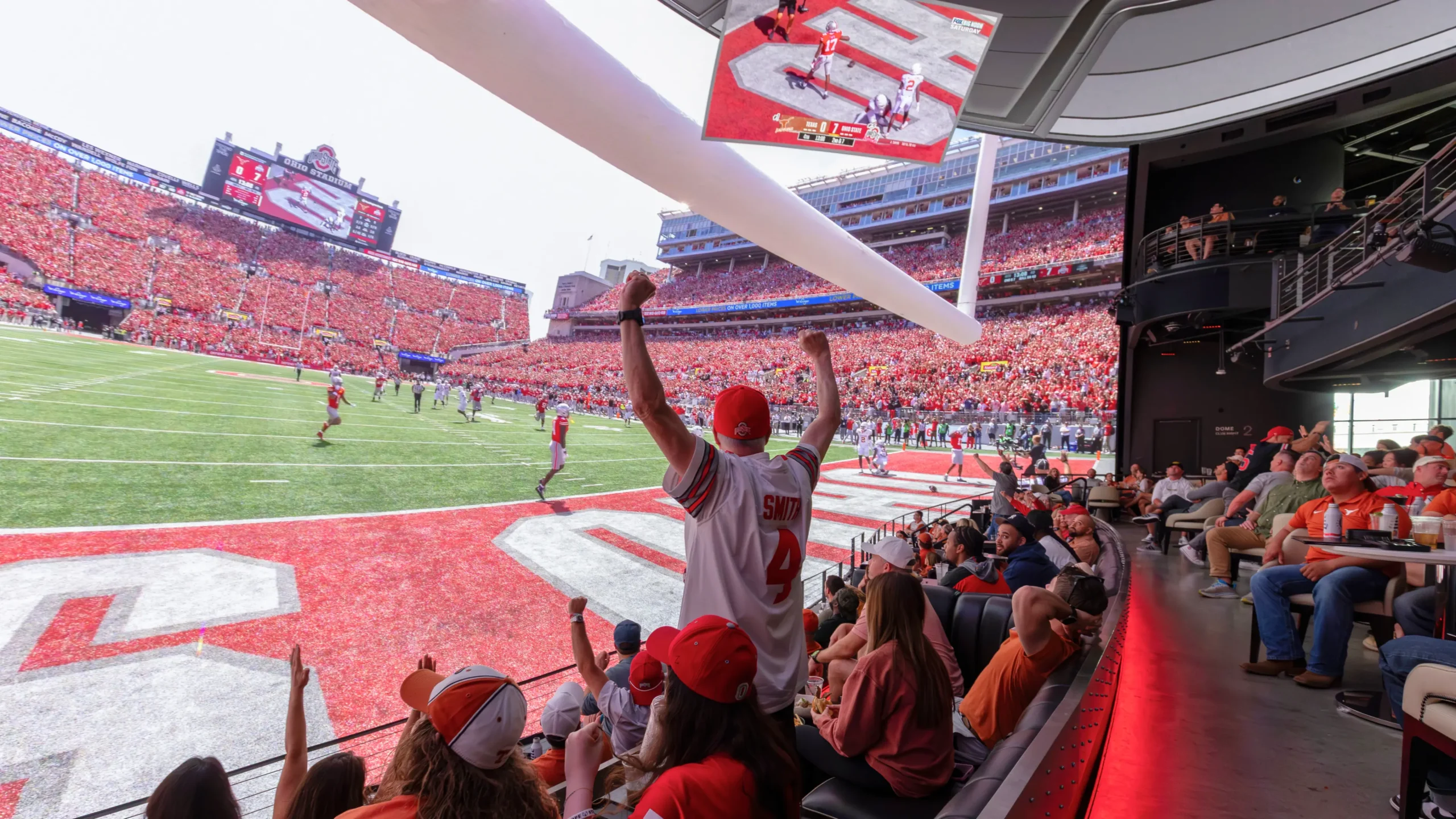 Ohio State fans celebrating at Cosm