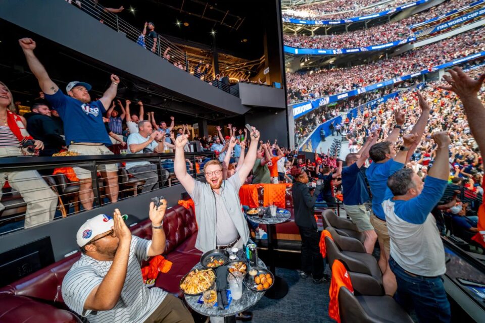 Fans celebrating the World Cup at Cosm