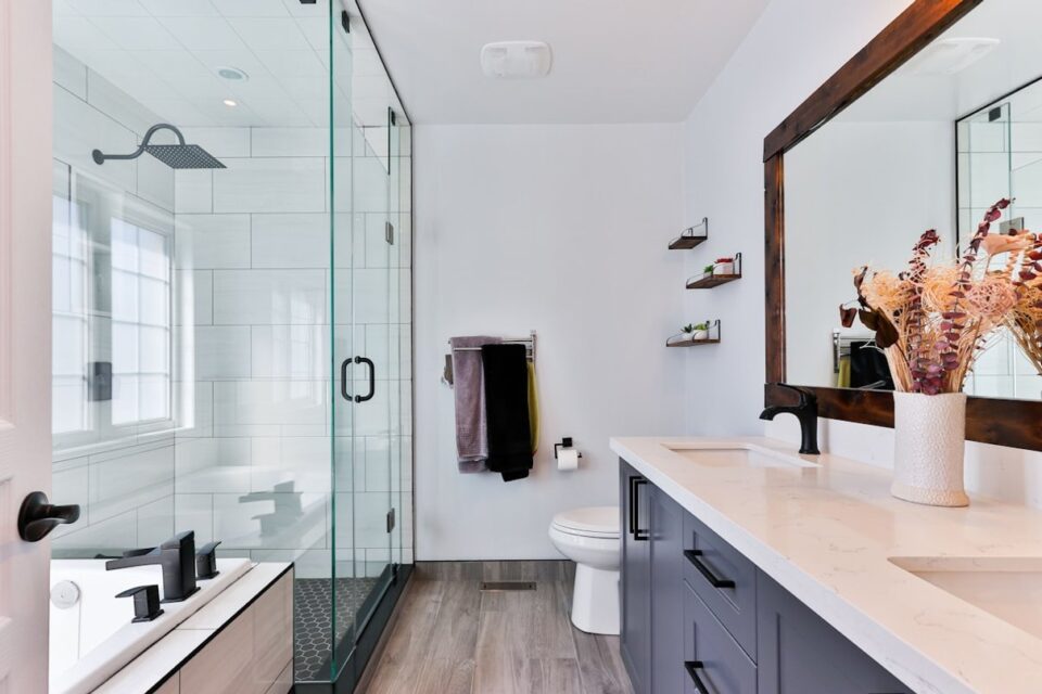 Minimal bathroom shower with clear glass and pale tile