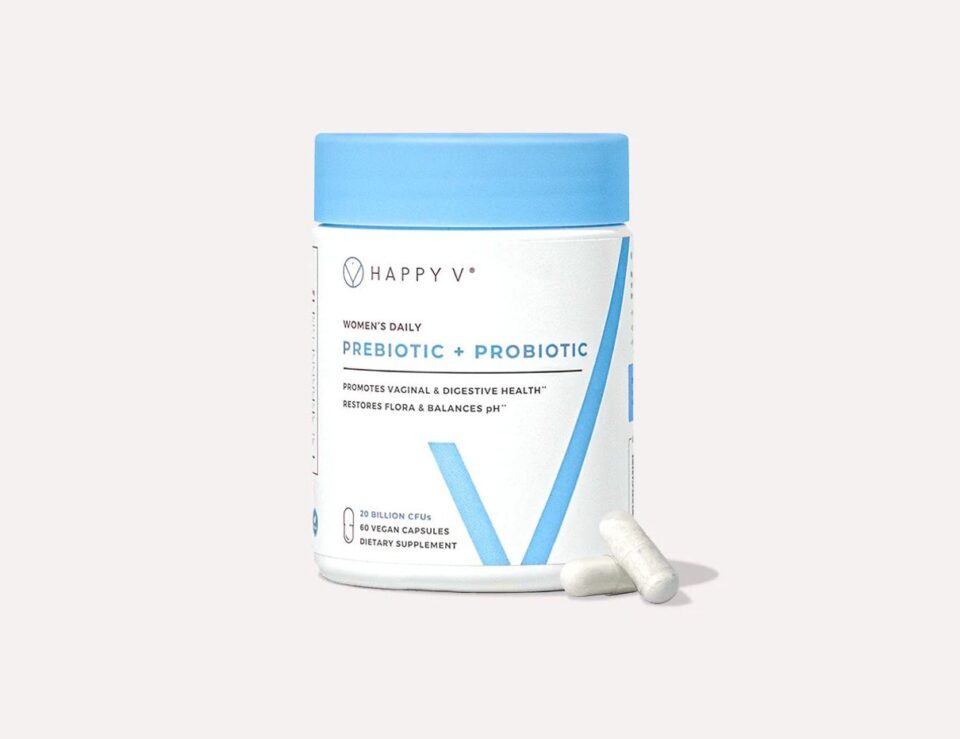 Happy V Prebiotic + Probiotic bottle with capsules on a gray background