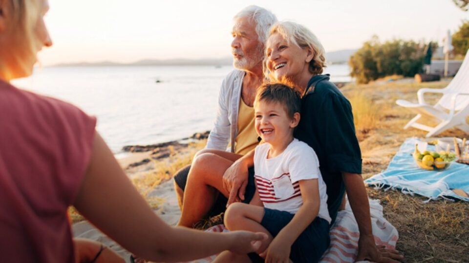 Travellers enjoying a holiday together beside the coast