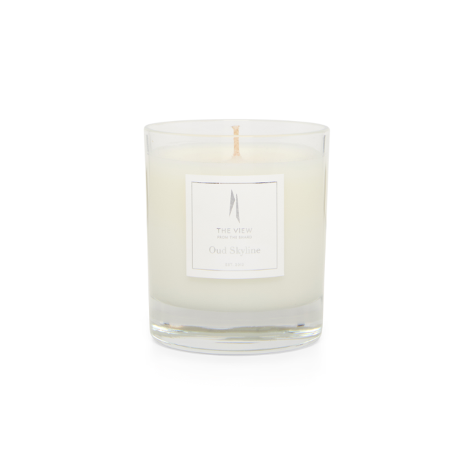 Shard Oud Skyline Candle in its branded glass vessel
