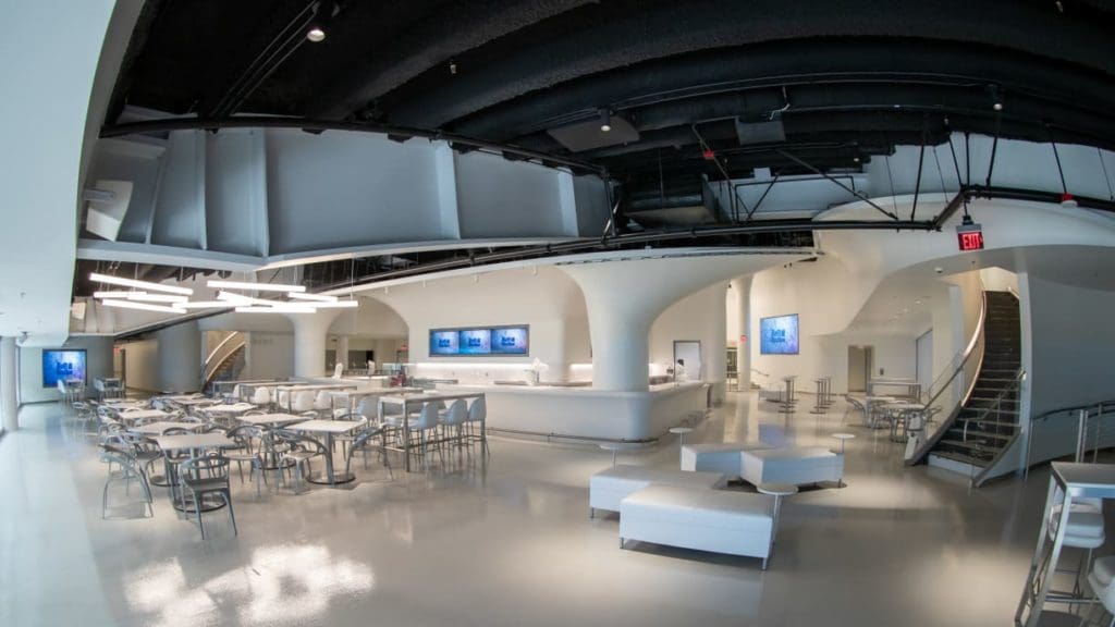 SoFi Stadium club-level lounge with seating and bar