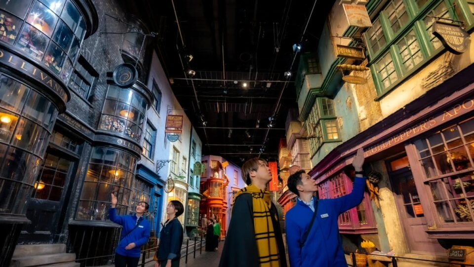 Visitors exploring the detailed Diagon Alley film set