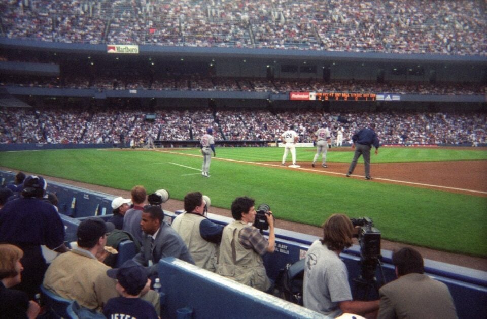 Fans seated beneath the frieze at Yankee Stadium