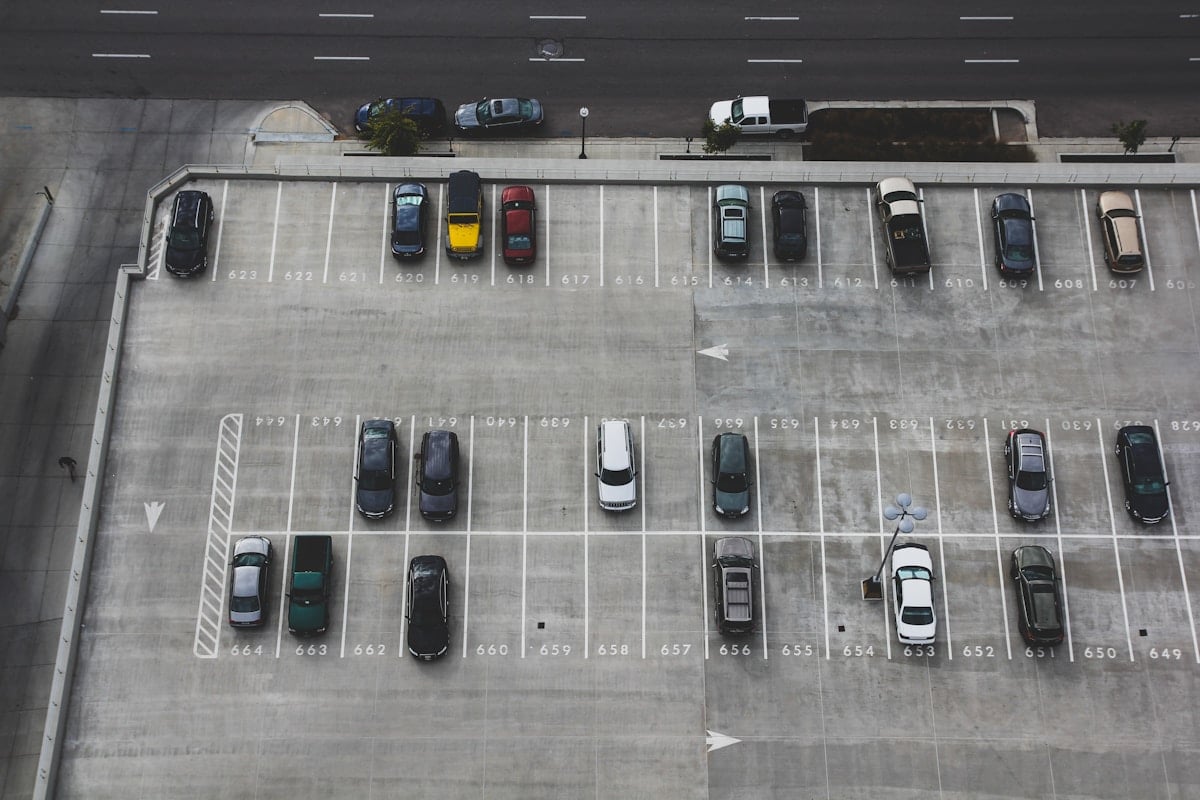Rows of cars in a secure outdoor parking area
