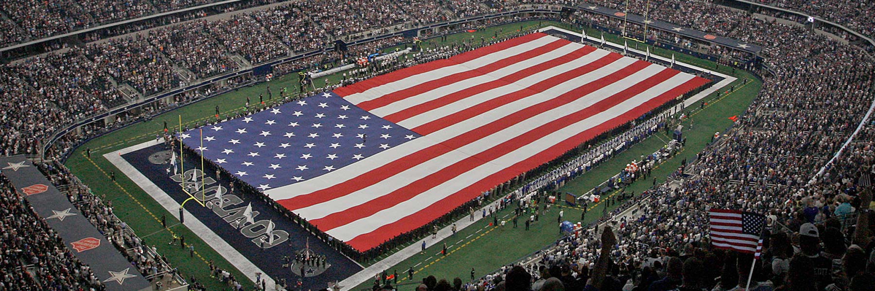 Flags and playing field inside AT&T Stadium