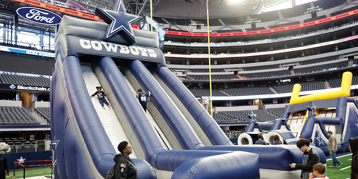 Inflatable slide inside AT&T Stadium during Rally Days