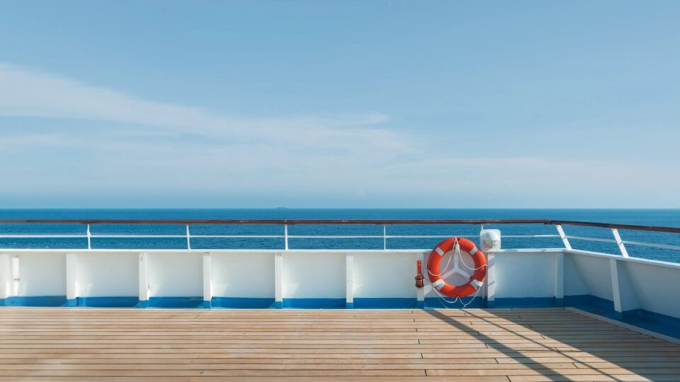 Cruise ship sailing on a bright blue sea