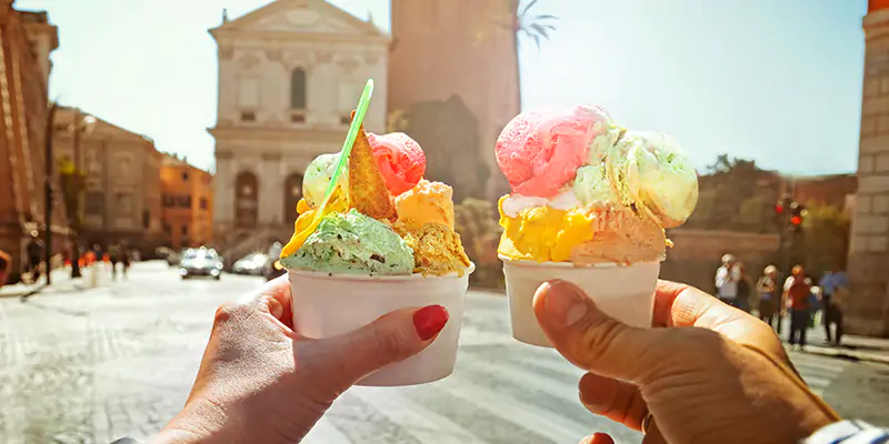 Couple enjoying ice cream together on holiday