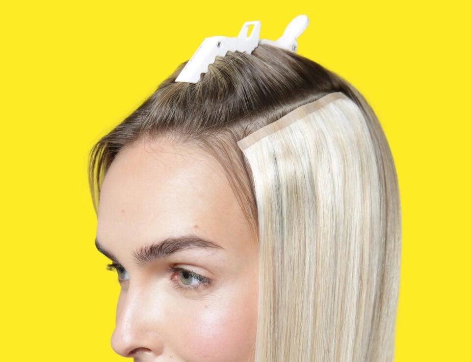 Biscuit Blondey seamless clip-in extensions shown in use