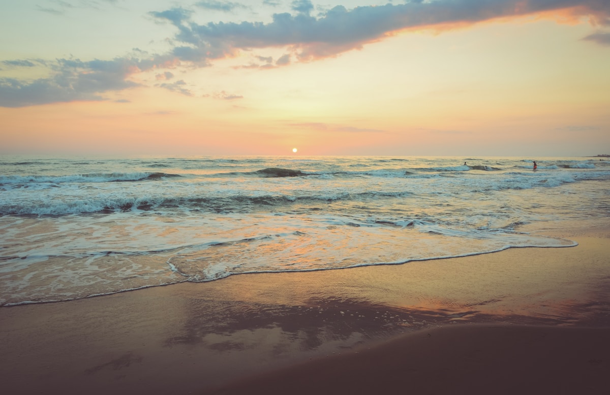 Turquoise sea beside a sandy tropical beach