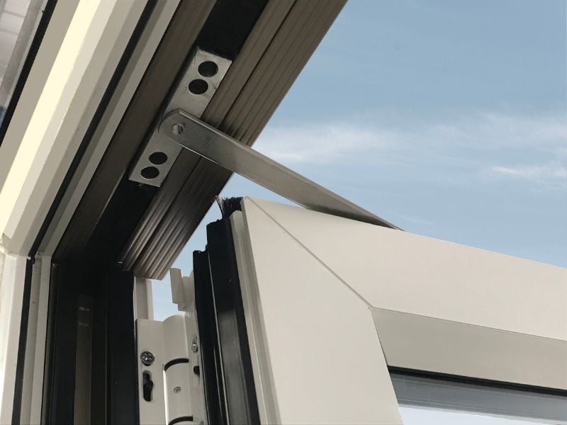 Installer fitting Eurocell uPVC bi-fold doors