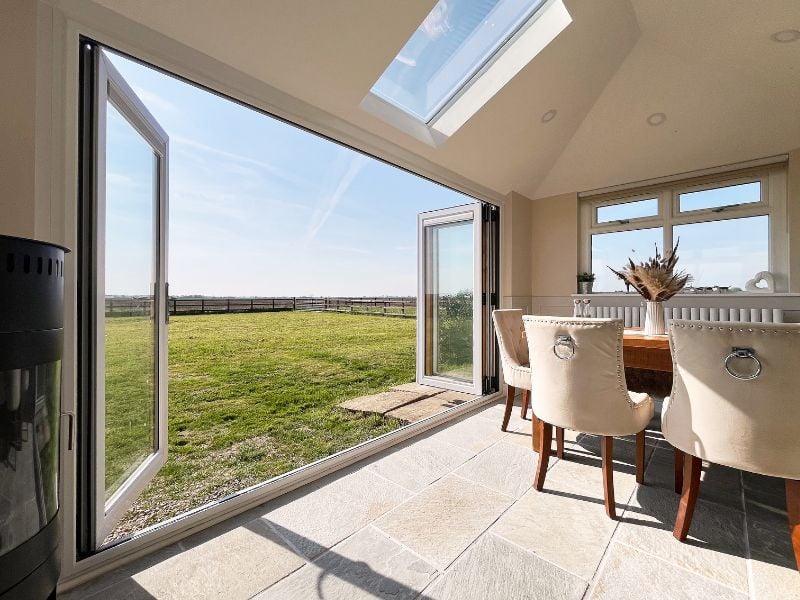 Eurocell bi-fold doors creating a wide opening to the garden
