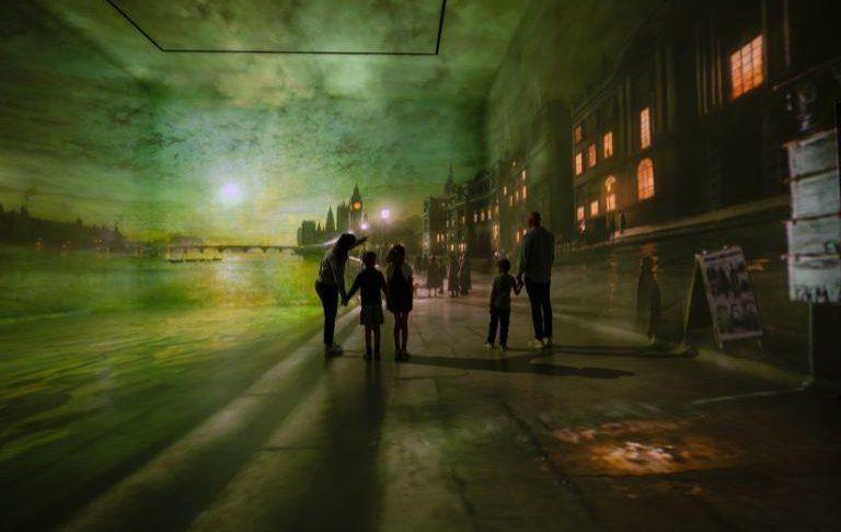 Family enjoying an immersive art gallery at Frameless London
