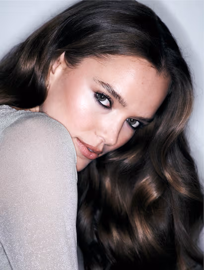 Woman with a fresh Glamsquad blowout from an in-home hair service