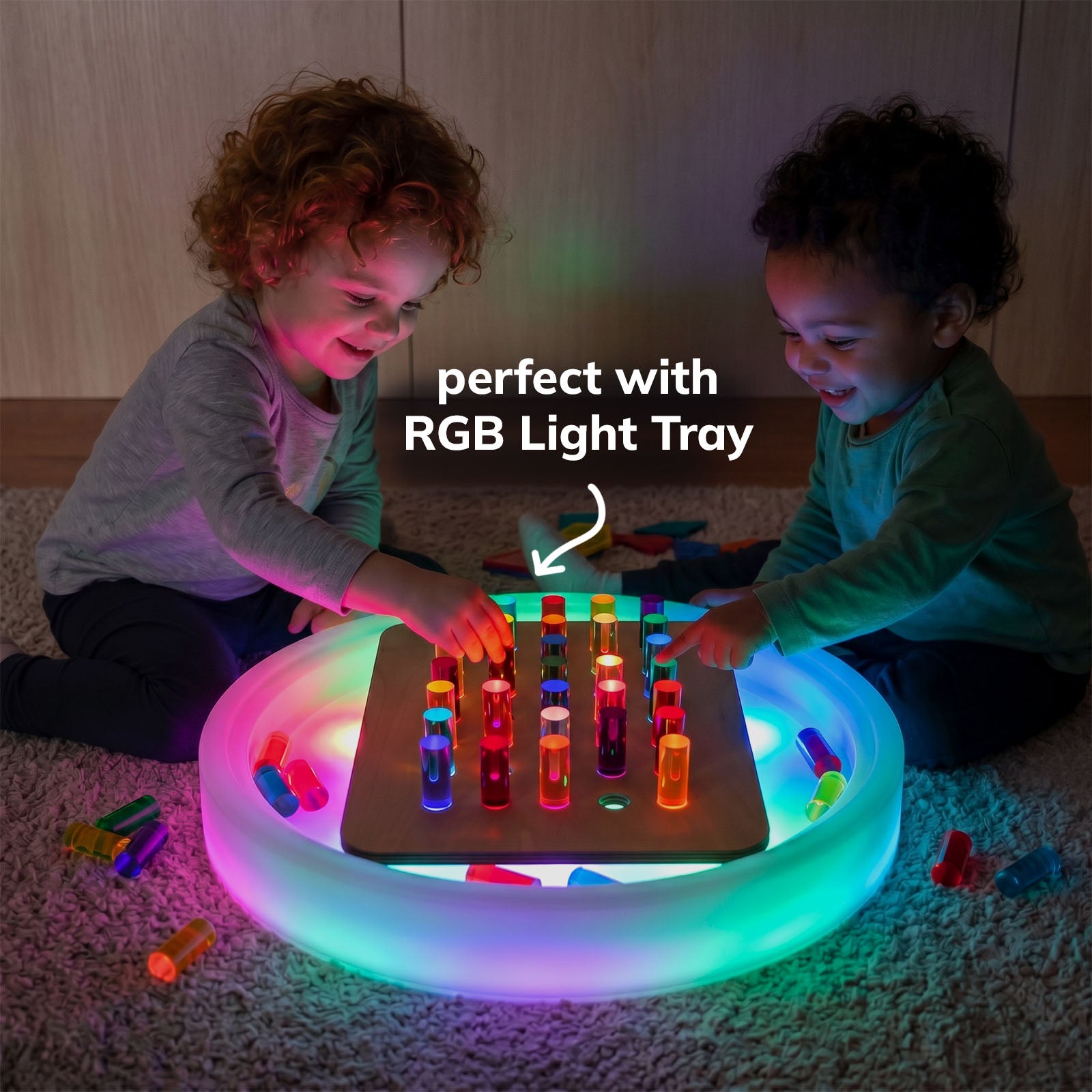 Rainbow Peg Board used over a colorful light table
