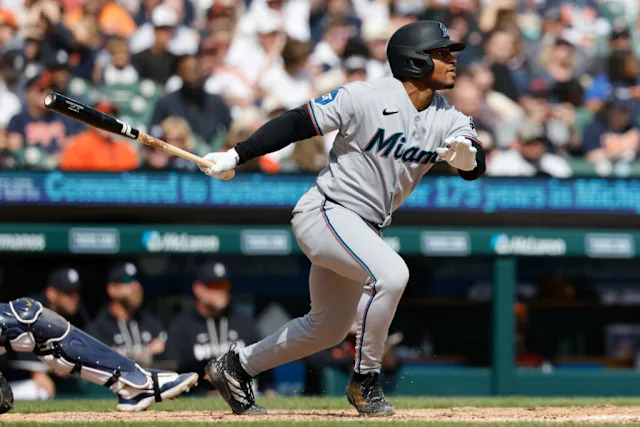 Miami Marlins player swinging at a pitch during a game