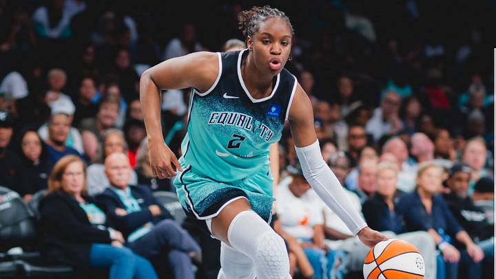 New York Liberty players on court as fans watch from Barclays Center