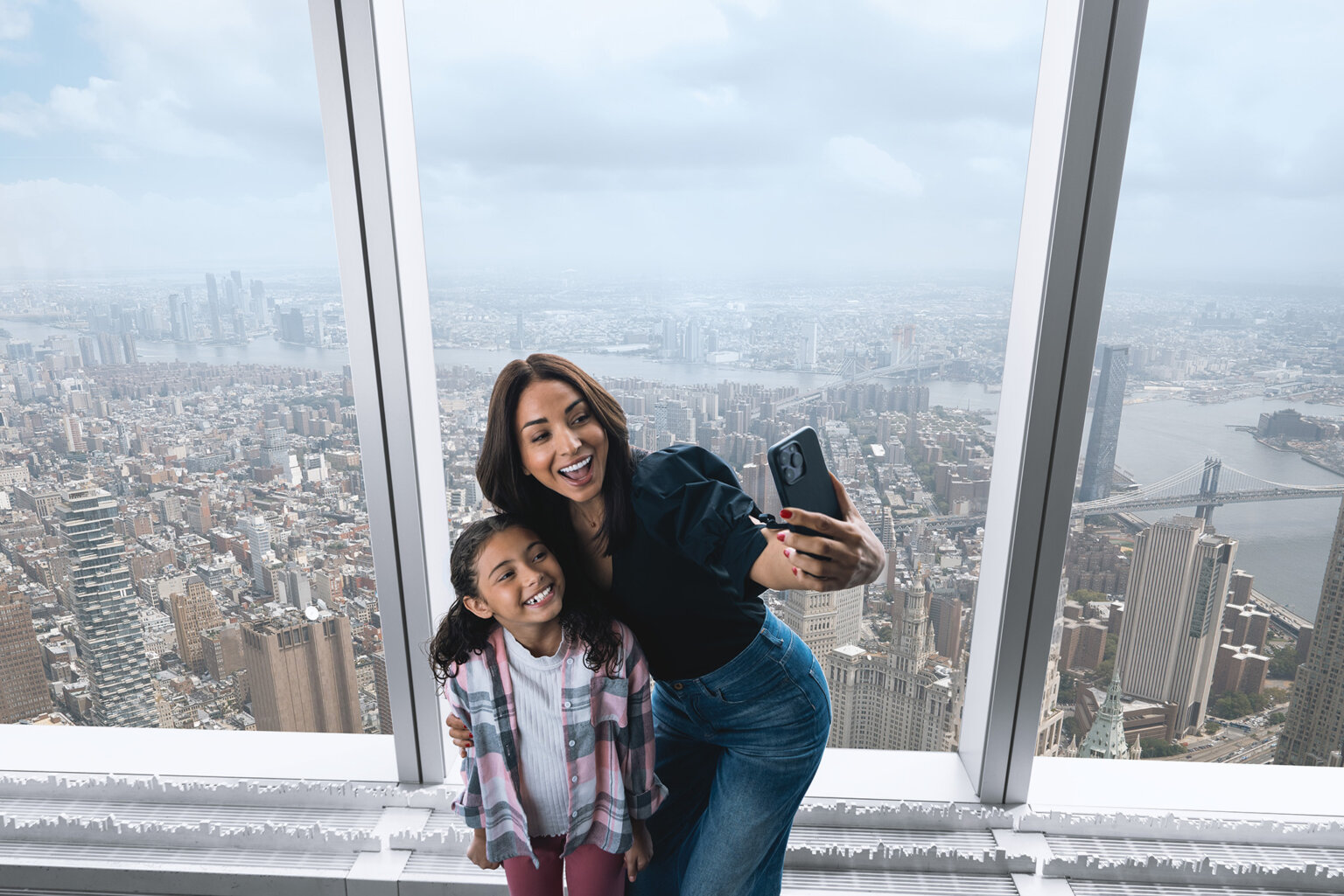 A family enjoying the observation floor at One World Observatory - New York
