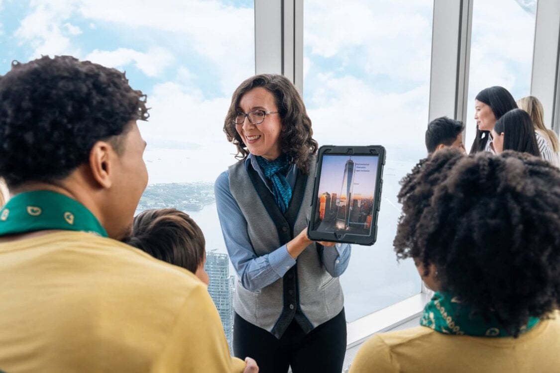 Guide leading visitors through One World Observatory