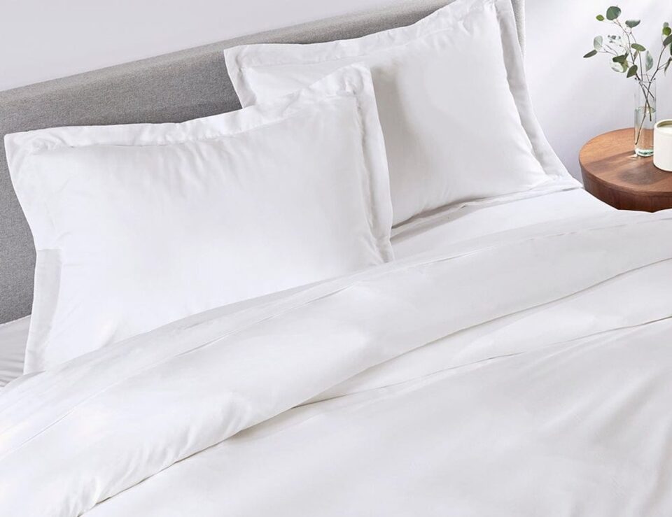 Classic White duvet cover styled on a bright bedroom bed