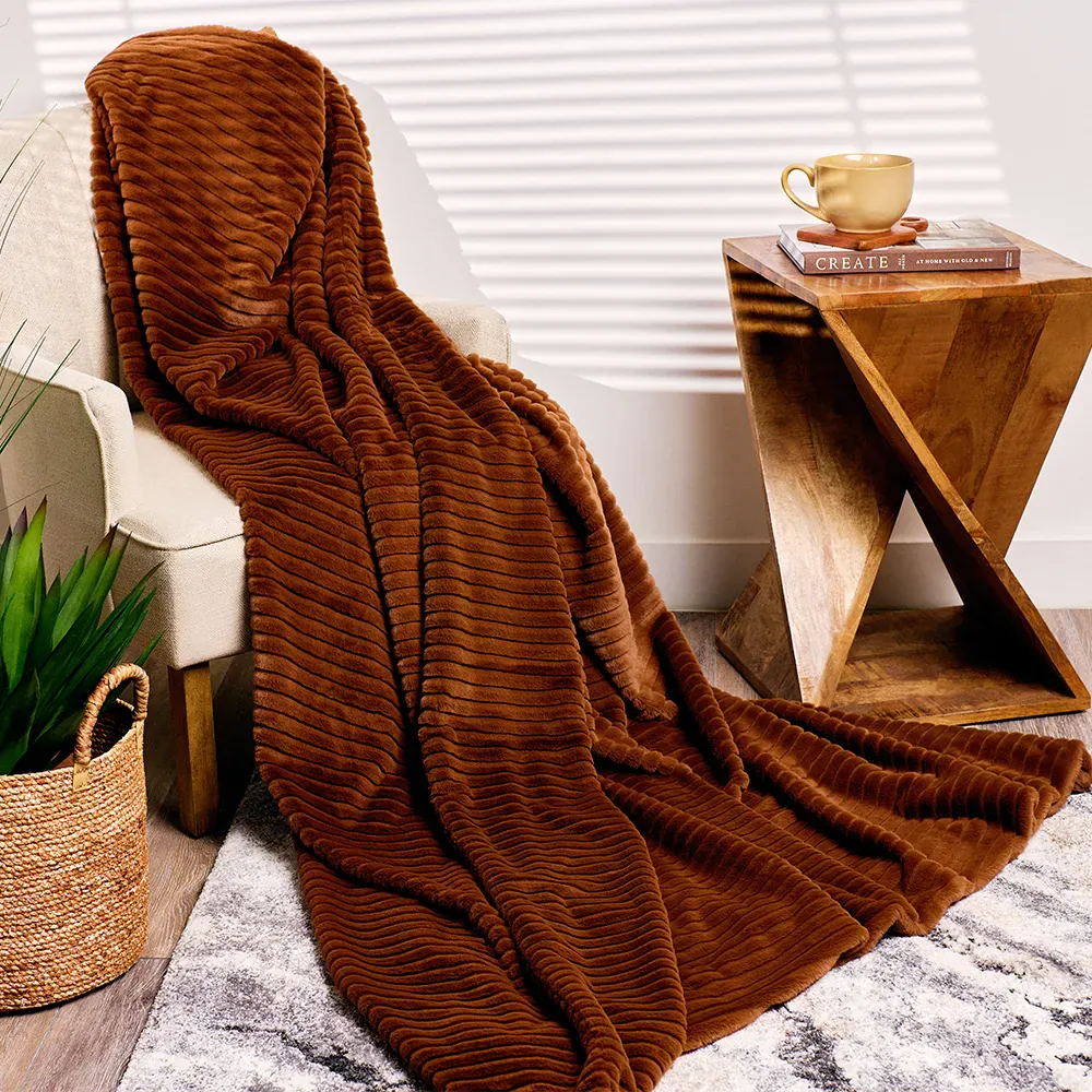 Cinnamon faux mink throw blanket draped in a living space