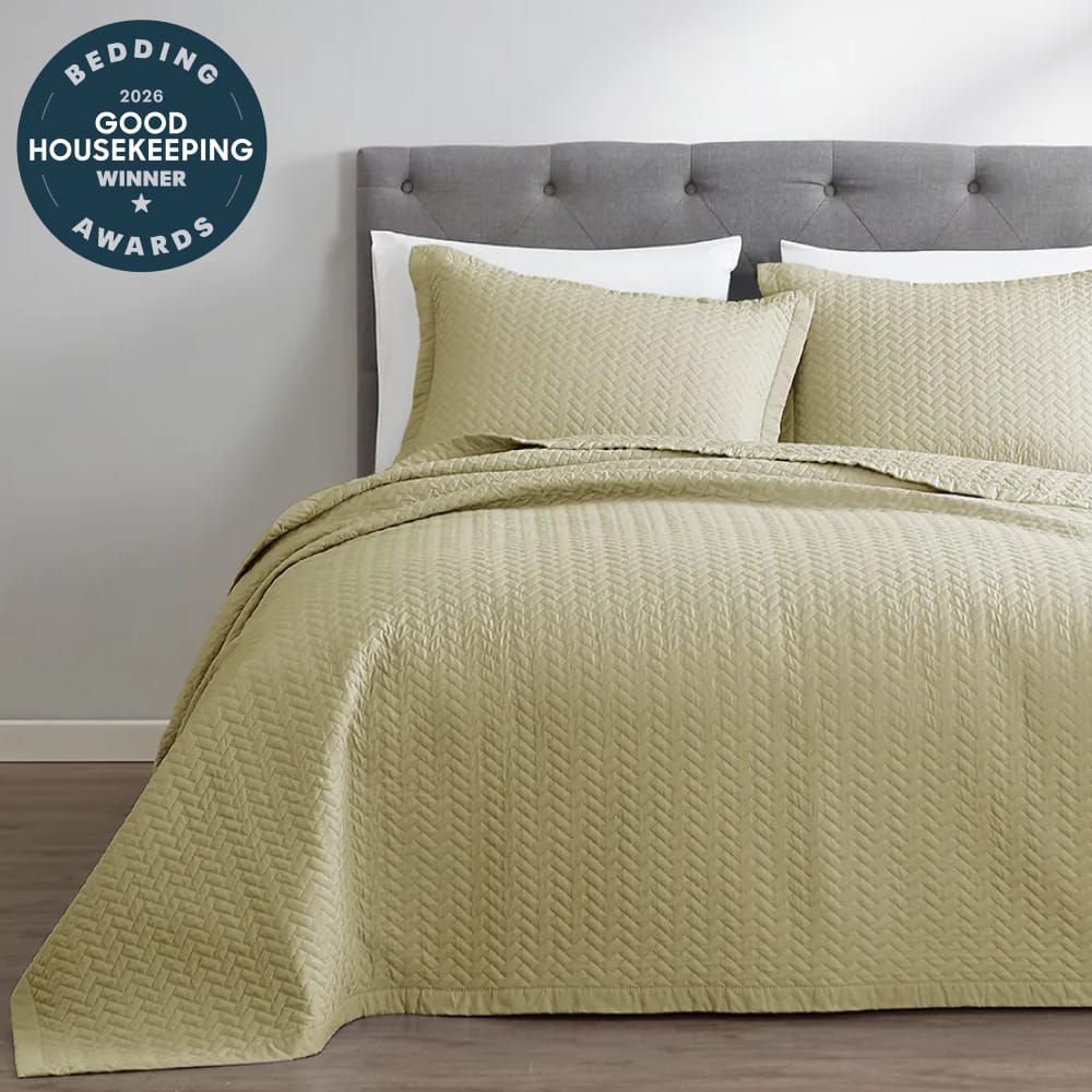 Sage Green oversized quilt styled on a bed