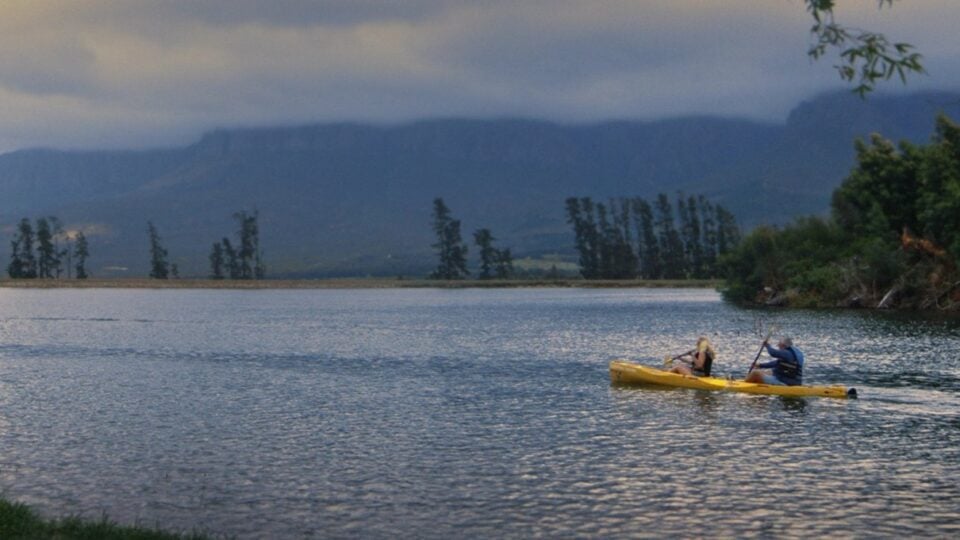 Travellers kayaking on a sunny holiday