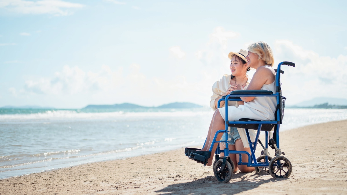 Wheelchair user enjoying a beach holiday