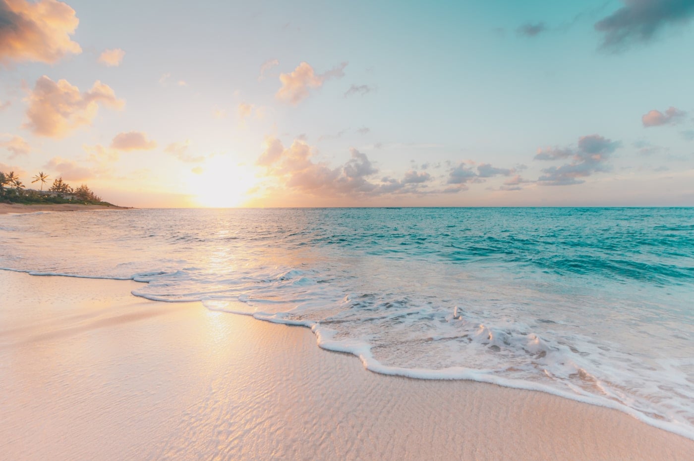 Clear blue sea beside a sandy beach