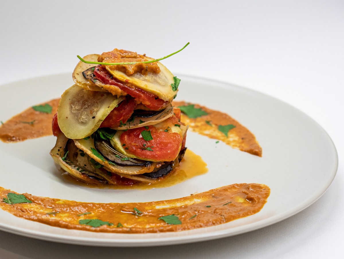 Plated vegetable stack on a white dish