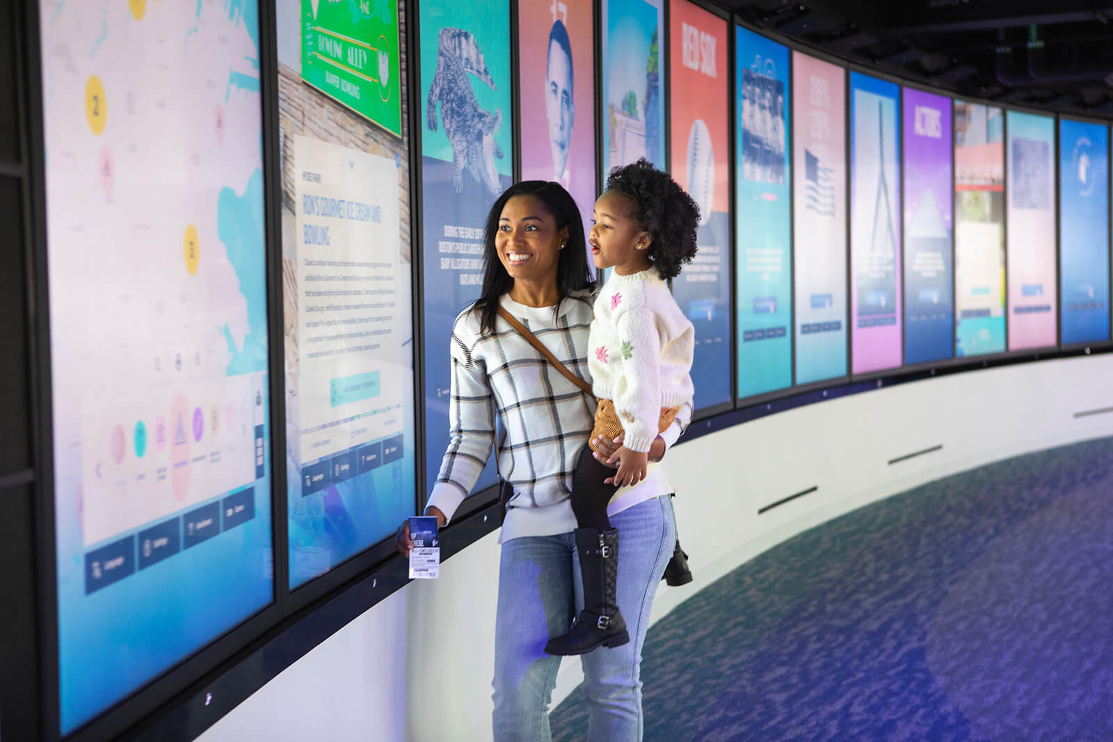 Mother and child at displays inside View Boston