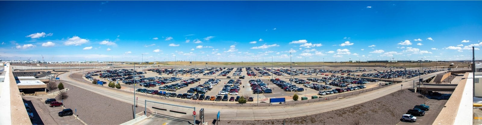 Rows of parked cars at an airport parking lot
