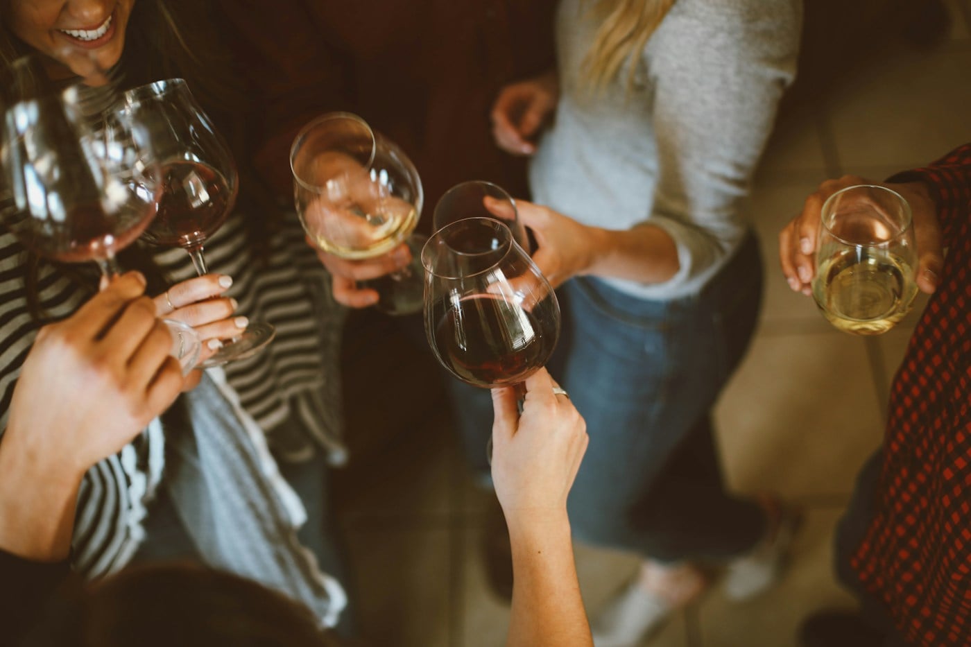 People toasting wine at a table