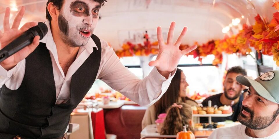 A Halloween afternoon tea bus tour scene in London
