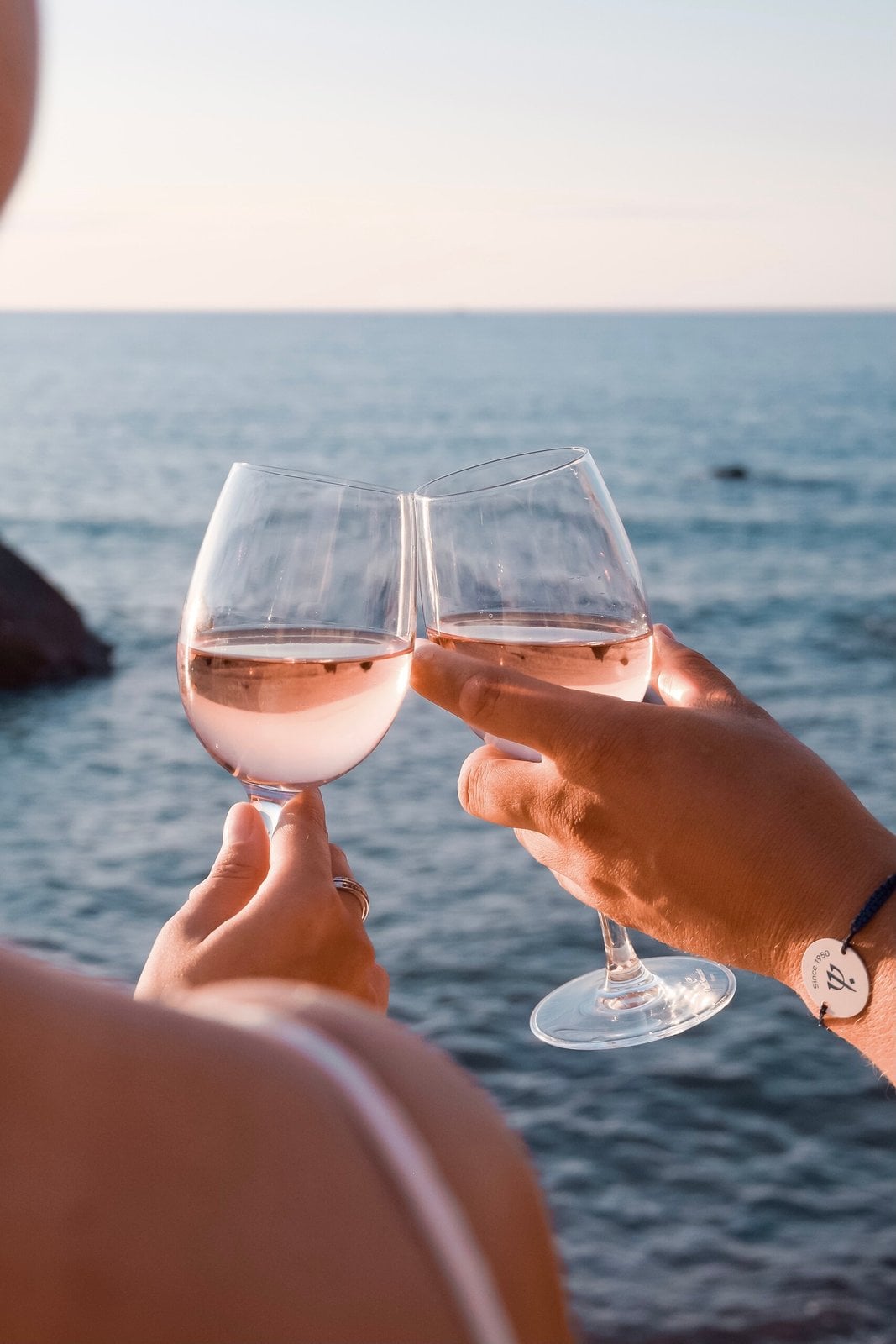 Drinks held up beside the sea at Club Med Cefalù
