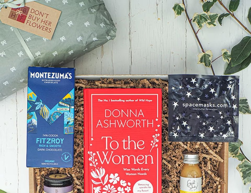 Book and treats arranged inside a gift box
