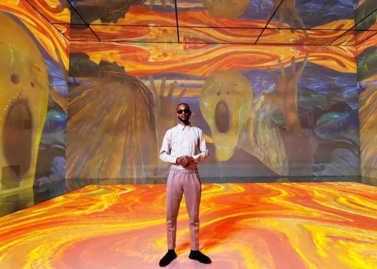 Visitors looking into an immersive gallery at Frameless