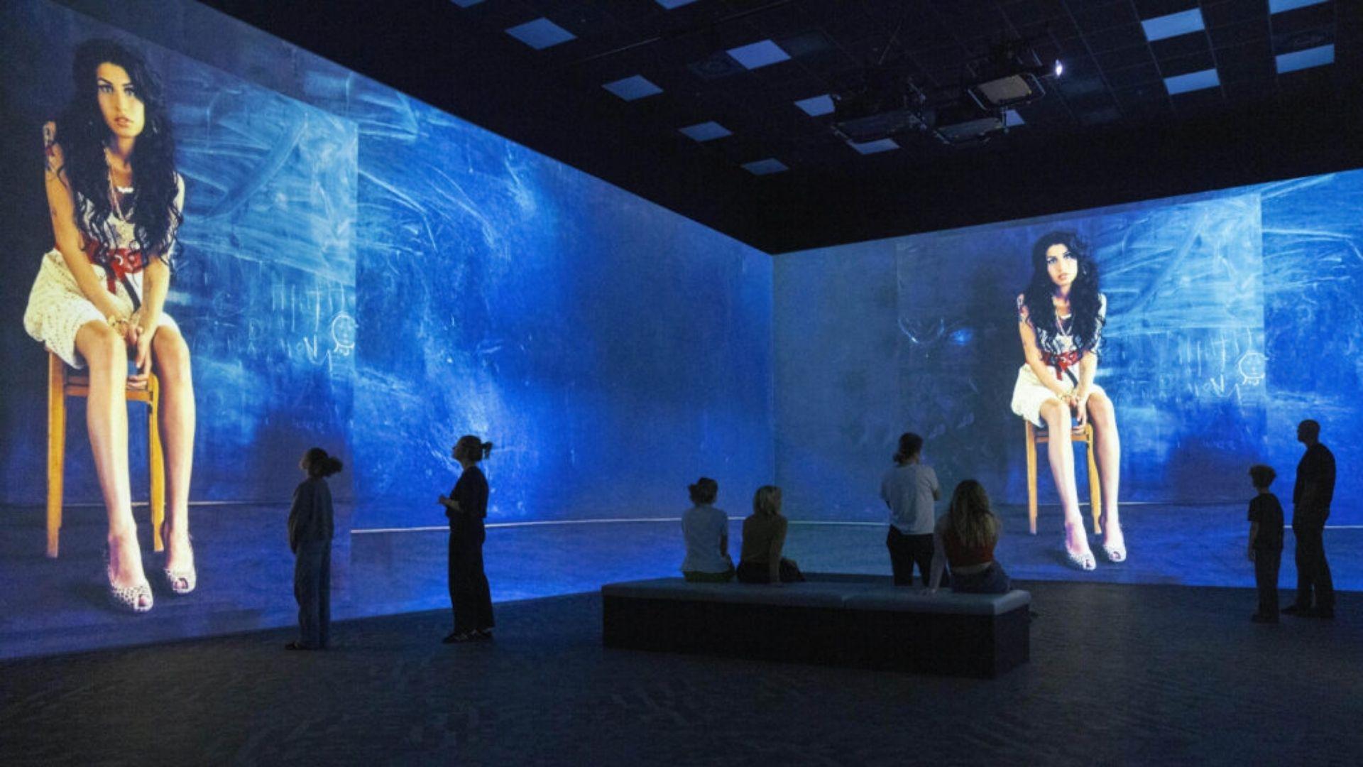 Visitors standing inside Stories - Brought to Life at Frameless