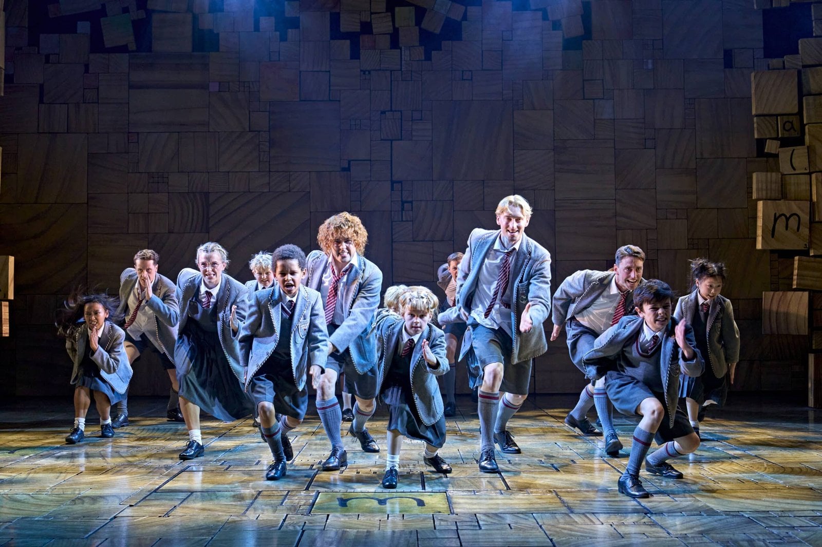 A performer playing Matilda appears with the company.