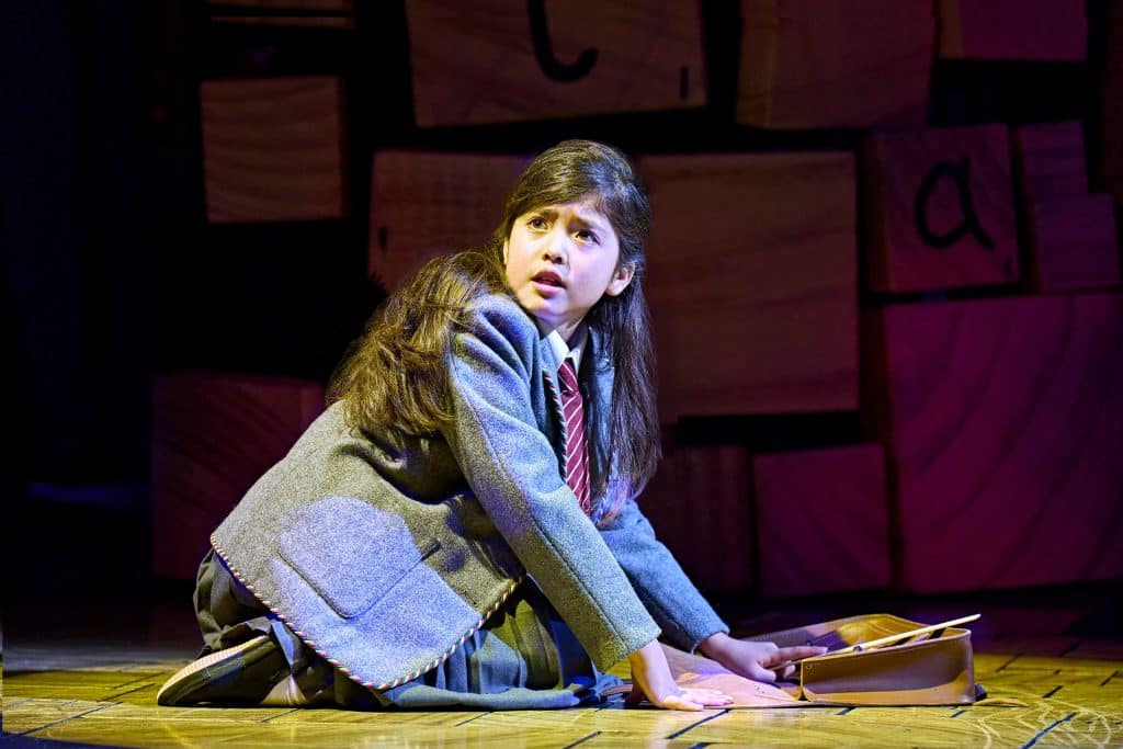 Matilda cast in a separate ensemble production scene