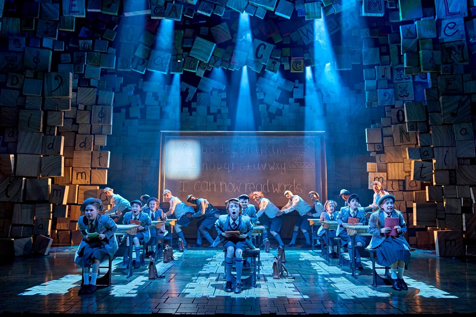 The Matilda cast performing on stage
