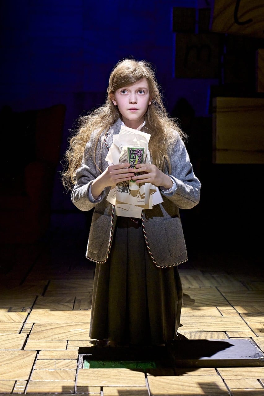 Matilda cast performing on stage in a production photograph