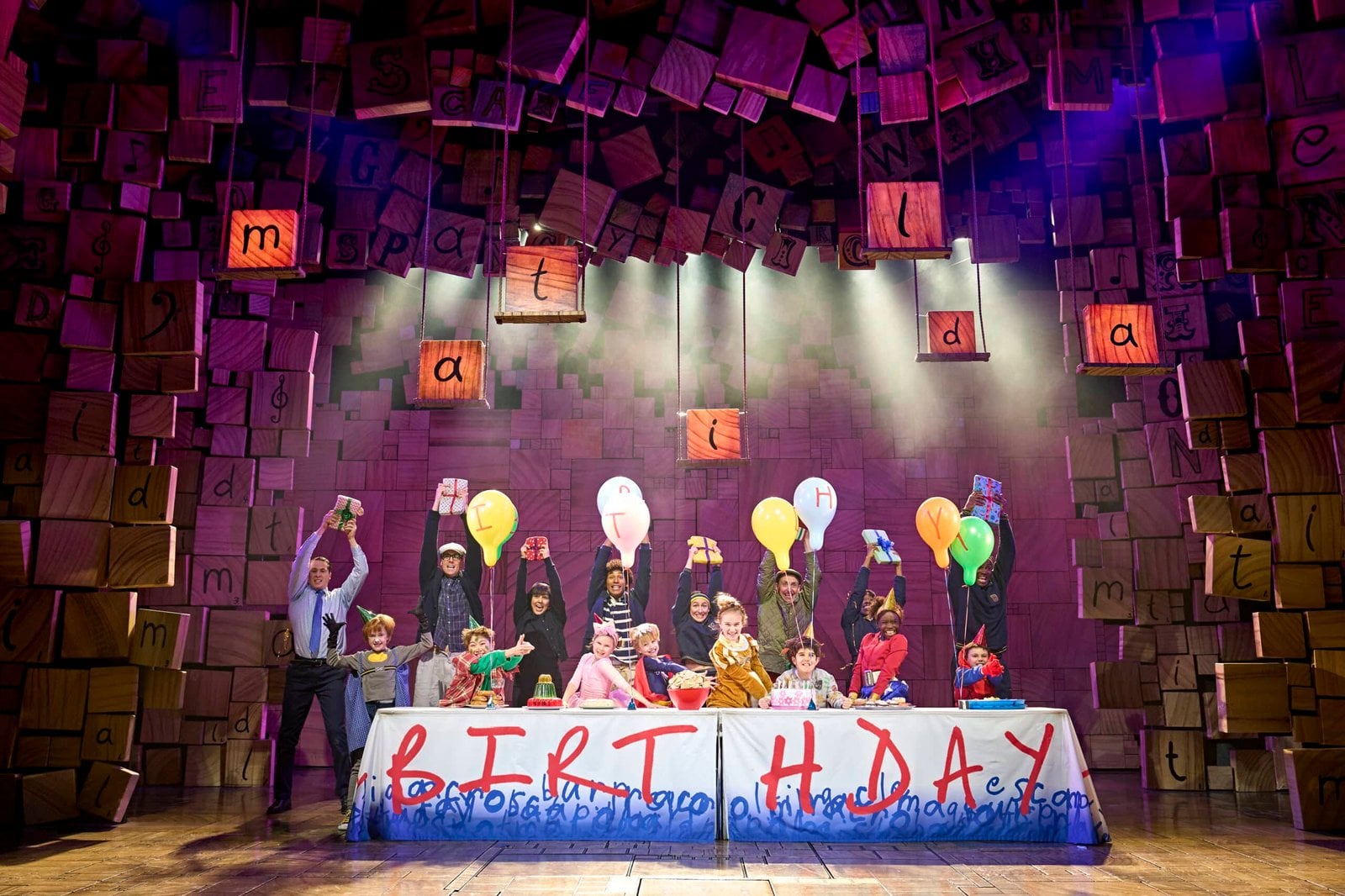 Matilda performers in a stage scene