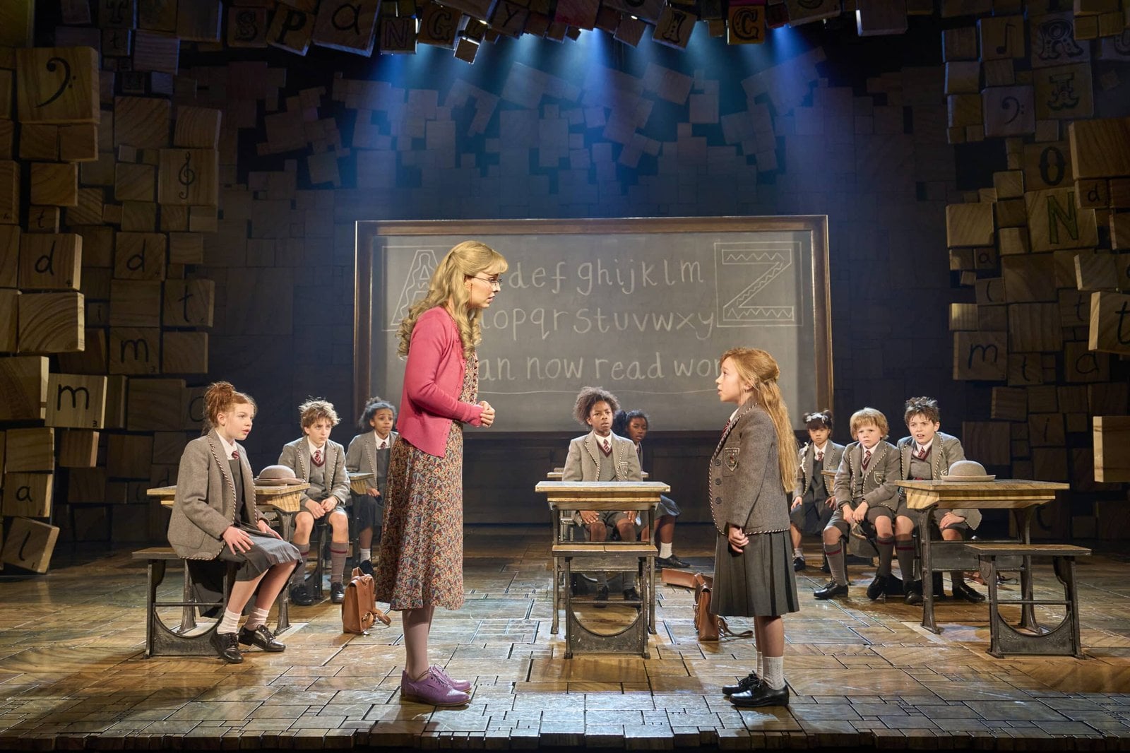 The company performs a scene from the stage production.