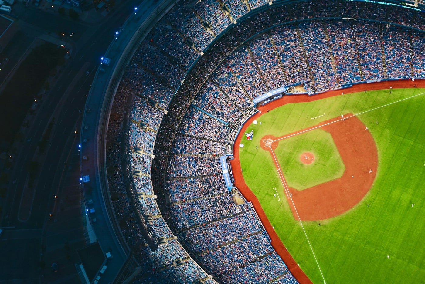 Wide view of a sports field and stadium