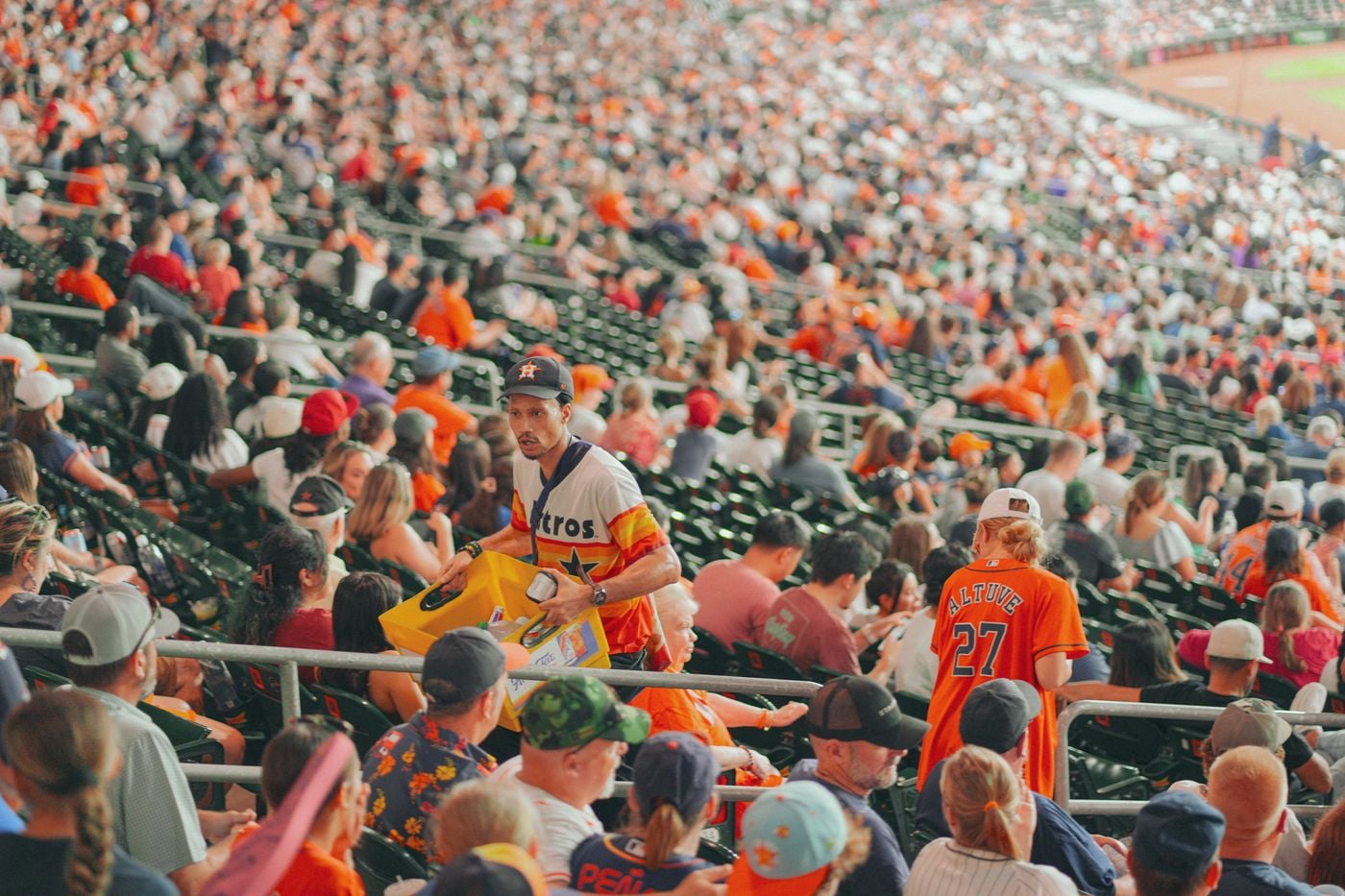 Baseball fans watching a game from the stands